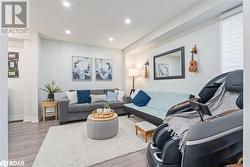 Living room with wood-type flooring - 