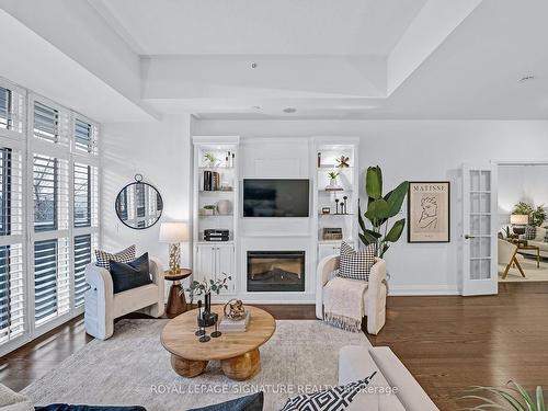 105-85 The Donway  W, Toronto, ON - Indoor Photo Showing Living Room With Fireplace