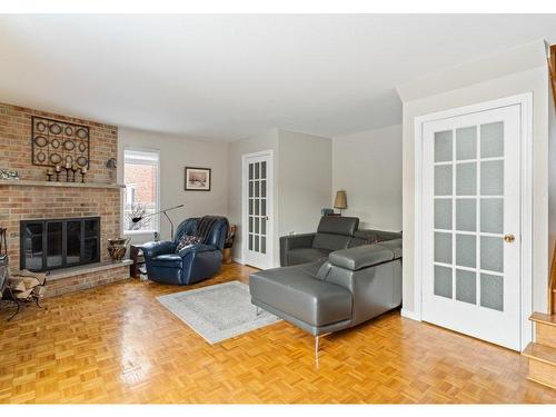 Family room - 2604 Rue De Vigny, Mascouche, QC - Indoor Photo Showing Living Room With Fireplace