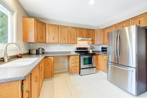 1634 Carshyl Court, Kelowna, BC - Indoor Photo Showing Kitchen With Double Sink