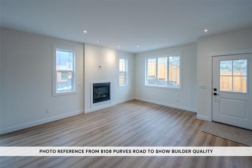 102-11610 Victoria Road, Summerland, BC - Indoor Photo Showing Living Room With Fireplace