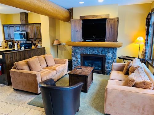 K3-A-1351 Gerry Sorensen Way, Kimberley, BC - Indoor Photo Showing Living Room With Fireplace