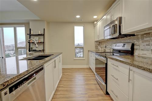 502-1160 Bernard Avenue, Kelowna, BC - Indoor Photo Showing Kitchen With Double Sink