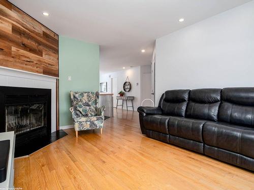 Living room - 486 Rue De L'Île-De-Mai, Terrebonne (Lachenaie), QC - Indoor Photo Showing Living Room With Fireplace