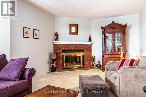 502 - 11 Cobourg Street, Stratford, ON - Indoor Photo Showing Living Room With Fireplace