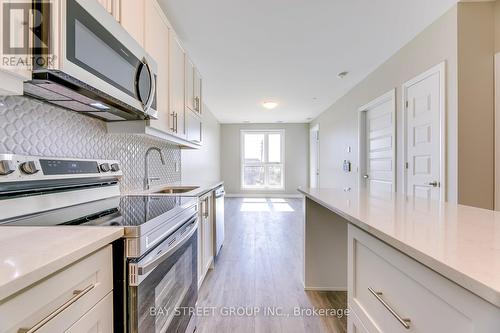 107 - 95 Dundas Street W, Oakville, ON - Indoor Photo Showing Kitchen With Upgraded Kitchen