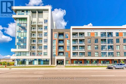 107 - 95 Dundas Street W, Oakville, ON - Outdoor With Balcony With Facade