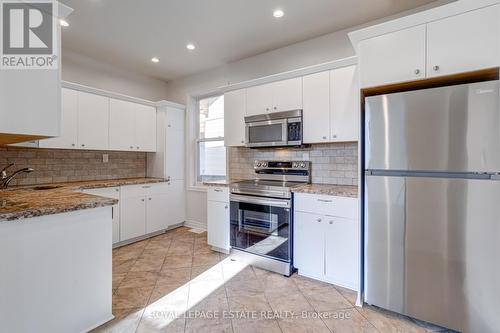 81 Ottawa Street N, Hamilton, ON - Indoor Photo Showing Kitchen With Double Sink