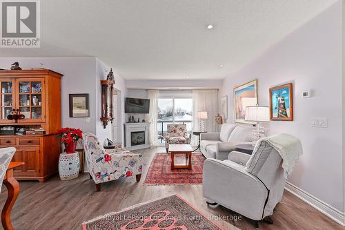 417 - 91 Raglan Street, Collingwood, ON - Indoor Photo Showing Living Room With Fireplace