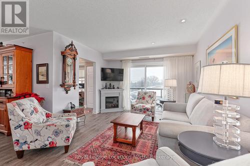 417 - 91 Raglan Street, Collingwood, ON - Indoor Photo Showing Living Room With Fireplace