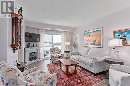 417 - 91 Raglan Street, Collingwood, ON - Indoor Photo Showing Living Room With Fireplace