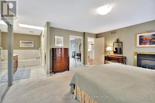 56 Honeysuckle Drive, Guelph (Village By The Arboretum), ON - Indoor Photo Showing Bedroom With Fireplace