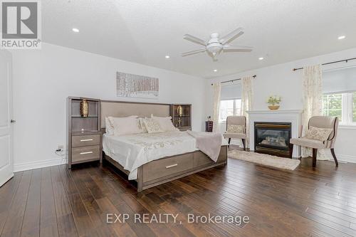 4 Champion Court, Brampton, ON - Indoor Photo Showing Bedroom With Fireplace