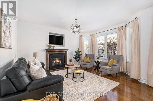 2174 Sunset Cove Circle, Ottawa, ON - Indoor Photo Showing Living Room With Fireplace