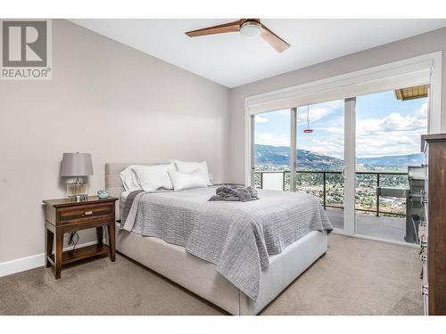 Primary bedroom, patio doors to deck - 3812 Terrapin Place, Vernon, BC - Indoor Photo Showing Bedroom