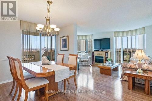 805 - 5080 Pinedale Avenue, Burlington, ON - Indoor Photo Showing Dining Room With Fireplace