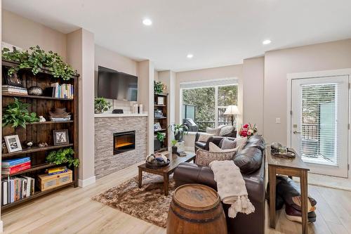 48-2490 Tuscany Drive, West Kelowna, BC - Indoor Photo Showing Living Room With Fireplace