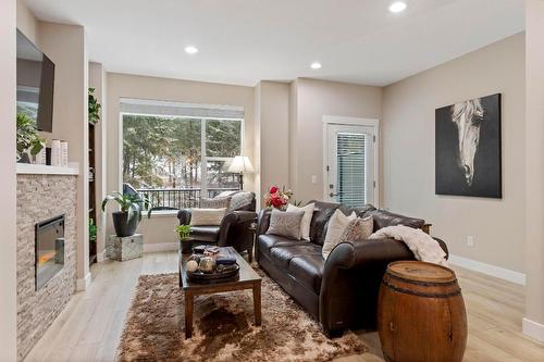 48-2490 Tuscany Drive, West Kelowna, BC - Indoor Photo Showing Living Room With Fireplace