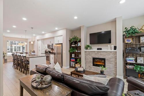 48-2490 Tuscany Drive, West Kelowna, BC - Indoor Photo Showing Living Room With Fireplace