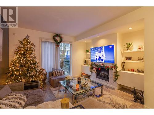 103 688 Edgar Avenue, Coquitlam, BC - Indoor Photo Showing Living Room With Fireplace