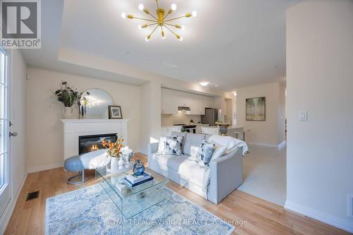 10 Coote Crt., Ajax, ON - Indoor Photo Showing Living Room With Fireplace