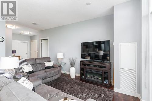 1201 - 2081 Fairview Street, Burlington, ON - Indoor Photo Showing Living Room With Fireplace