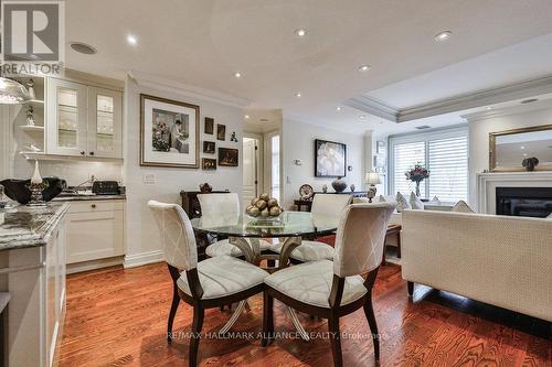 201 - 111 Forsythe Street, Oakville, ON - Indoor Photo Showing Dining Room With Fireplace