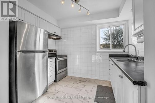 51 - 2035 Asta Drive, Mississauga, ON - Indoor Photo Showing Kitchen With Double Sink