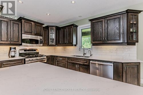 174 River Run Road, Mapleton, ON - Indoor Photo Showing Kitchen With Double Sink