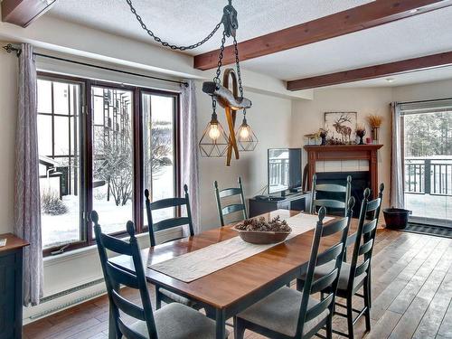 Salle Ã  manger - 1-142 Rue Pinoteau, Mont-Tremblant, QC - Indoor Photo Showing Dining Room With Fireplace