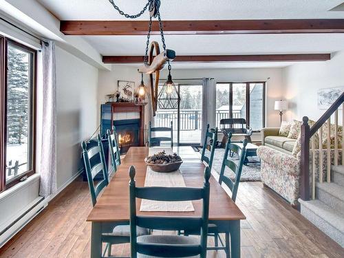 Salle Ã  manger - 1-142 Rue Pinoteau, Mont-Tremblant, QC - Indoor Photo Showing Dining Room With Fireplace