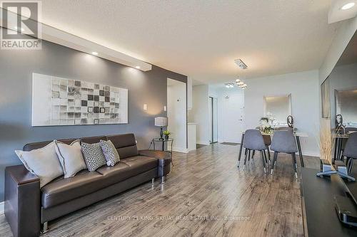 1410 - 2050 Bridletowne Circle, Toronto, ON - Indoor Photo Showing Living Room