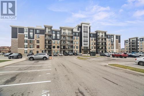 203 - 650 Suave Street, Milton, ON - Outdoor With Balcony With Facade