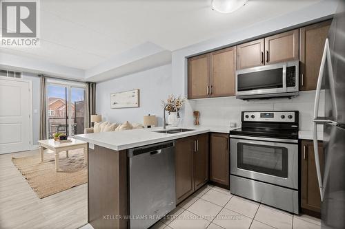 203 - 650 Suave Street, Milton, ON - Indoor Photo Showing Kitchen With Stainless Steel Kitchen With Double Sink