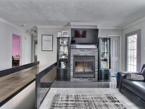 Living room - 208 Rue Gilbert, Saint-Joseph-De-Beauce, QC - Indoor Photo Showing Living Room With Fireplace