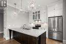 206 404 Cartwright Street, Saskatoon, SK  - Indoor Photo Showing Kitchen With Double Sink With Upgraded Kitchen 