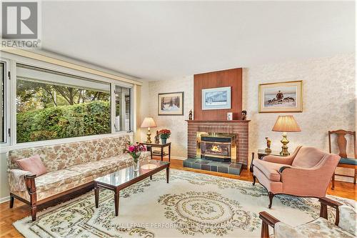 2427 Ogilvie Road, Ottawa, ON - Indoor Photo Showing Living Room With Fireplace