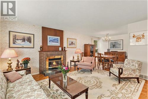 2427 Ogilvie Road, Ottawa, ON - Indoor Photo Showing Living Room With Fireplace