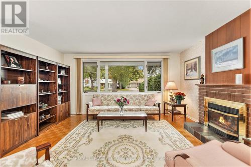 2427 Ogilvie Road, Ottawa, ON - Indoor Photo Showing Living Room With Fireplace