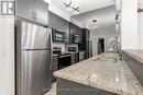 428 - 16 Concord Place, Grimsby (540 - Grimsby Beach), ON  - Indoor Photo Showing Kitchen With Stainless Steel Kitchen With Double Sink With Upgraded Kitchen 