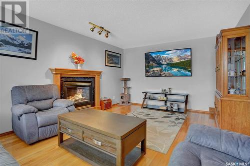 416 Byars Bay N, Regina, SK - Indoor Photo Showing Living Room With Fireplace