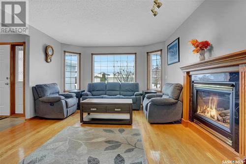 416 Byars Bay N, Regina, SK - Indoor Photo Showing Living Room With Fireplace