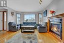 416 Byars Bay N, Regina, SK  - Indoor Photo Showing Living Room With Fireplace 