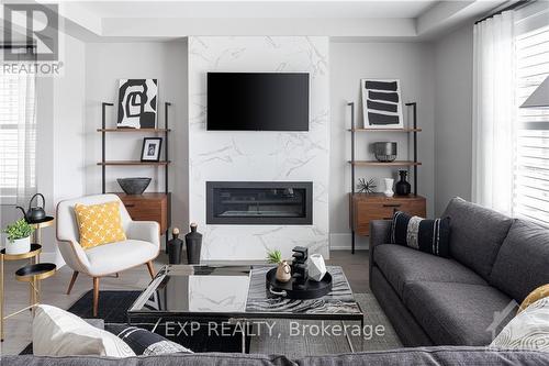 153 Robert Perry Street, North Grenville, ON - Indoor Photo Showing Living Room With Fireplace