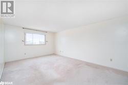 View of carpeted spare room - 