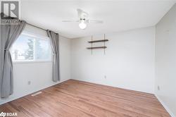 Unfurnished room featuring ceiling fan and light wood-type flooring - 