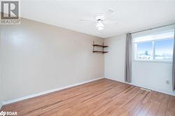 Empty room featuring ceiling fan and light hardwood / wood-style flooring - 