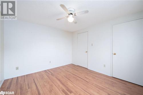 Unfurnished room with ceiling fan, a textured ceiling, and light hardwood / wood-style flooring - 15 Oakington Place, Mississauga, ON - Indoor Photo Showing Other Room