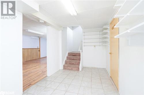 Staircase with a drop ceiling and wood walls - 15 Oakington Place, Mississauga, ON - Indoor Photo Showing Other Room