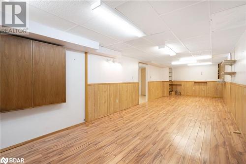 Basement with a paneled ceiling and light hardwood / wood-style flooring - 15 Oakington Place, Mississauga, ON - Indoor